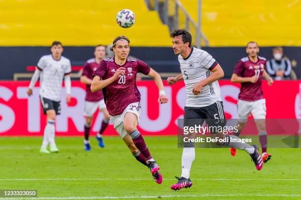 Roberts Uldrikis of Latvia and Mats Hummels of Germany battle for the ball during the international friendly match between Germany and Latvia at...