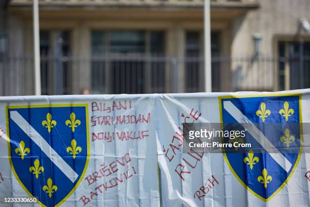 Bosniak flags with the names of cities where war crimes were committed during the 1992 - 1995 war in Bosnia and Herzegovina outside the entrance of...