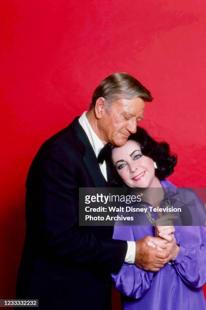 John Wayne, Elizabeth Taylor promotional photo for the ABC tv special 'General Electric's All-Star Anniversary'.