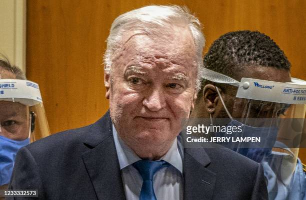 Ex-Bosnian Serb military chief Ratko Mladic arrives in the courtroom prior to the hearing of the final verdict on appeal against his genocide...