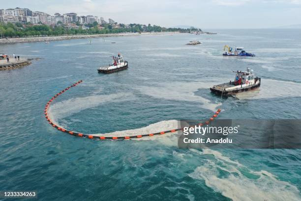 Drone photo shows a cleaning process for removing of mucilage also known colloquially as sea snot invading the Marmara Sea, at Caddebostan shore in...