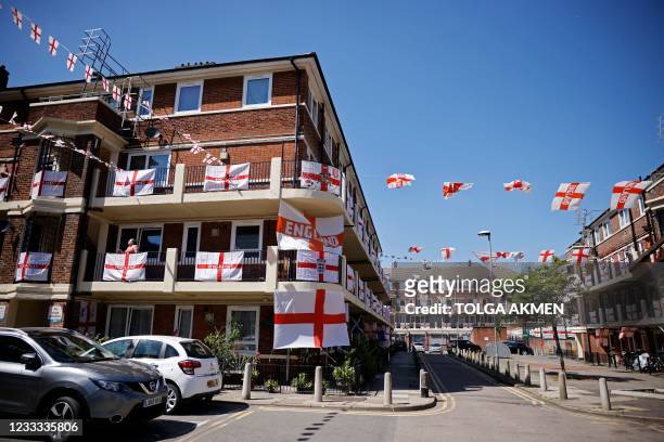 St George's flags, the national flag of England, fly from residents' homes at the Kirby Estate in Bermondsey, south London on June 8 on the eve the...