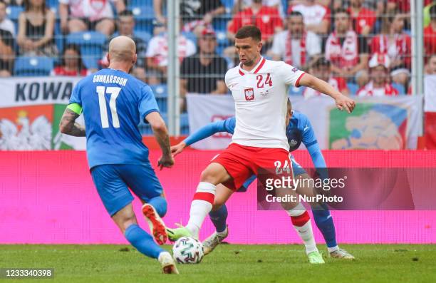 Jakub Swierczok Aron Gunnarsson, in action during the international friendly match between Poland and Iceland at Stadion Poznan on June 08, 2021 in...