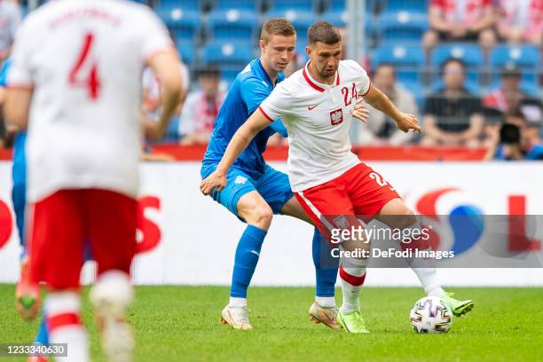Jakub Swierczok of Poland battle for the ball during the international friendly match between Poland and Iceland at Stadion Miejski on June 8, 2021...