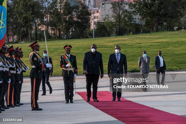 Ethiopia's Prime Minister Abiy Ahmed welcomes President of Kenya Uhuru Kenyatta during a ceremony for the signing of Ethiopias telecom licensing...