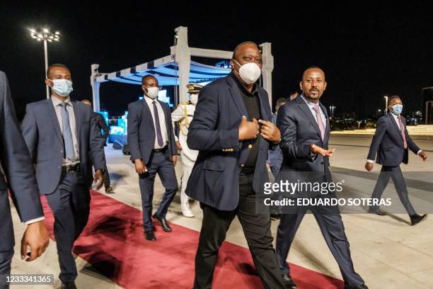Uhuru Kenyatta , President of Kenya, and Abiy Ahmed, Prime Minister of Ethiopia, walk out after the ceremony for the signing of Ethiopias telecom...