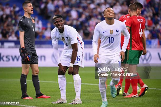 Bulgaria's goalkeeper Daniel Naumov, France's midfielder Paul Pogba and France's forward Kylian Mbappe react during the friendly football match...