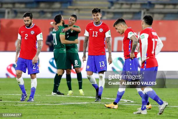 Chile's players react at the end of their South American qualification football match for the FIFA World Cup Qatar 2022 against Bolivia at the...