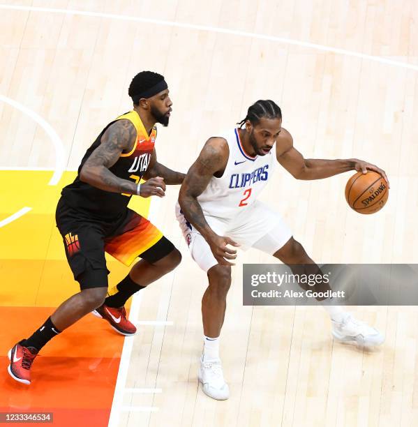 Kawhi Leonard of the Los Angeles Clippers drives against Royce O'Neale of the Utah Jazz in Game One of the Western Conference second-round playoff...