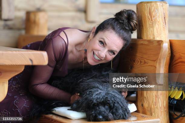 Christine Neubauer and her dog Gismol pose during the 3rd season "Watzmann ermittelt" photocall for "Die verkaufte Braut" on June 8, 2021 at...