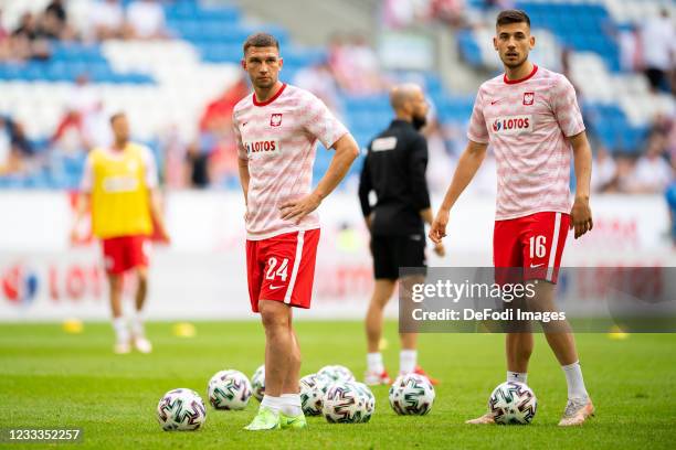 Jakub Swierczok of Poland and Jakub Moder of Poland warm up prior to the international friendly match between Poland and Iceland at Stadion Miejski...