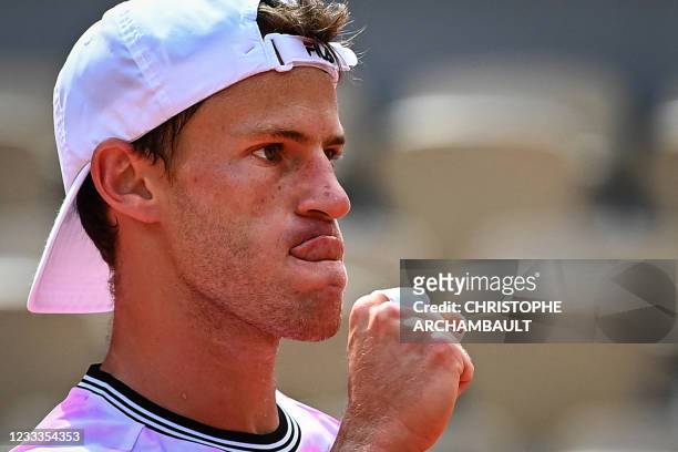 Argentina's Diego Schwartzman reacts as he plays against Spain's Rafael Nadal during their men's singles quarter-final tennis match on Day 11 of The...