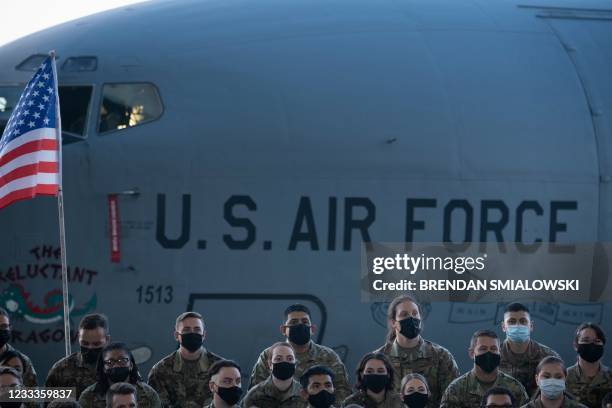 Air Force personnel and their families stationed at Royal Air Force Mildenhall listen to US President Joe Biden's address in Suffolk, England on June...