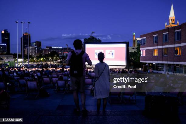People wait for screening of the film "The Girl and the Spider" Das Maedchen und die Spinne at the open air cinema Kulturforum during 71st Berlin...
