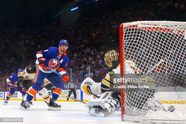 Brock Nelson of the New York Islanders scores a goal past Tuukka Rask of the Boston Bruins during the second period in Game Six of the Second Round...