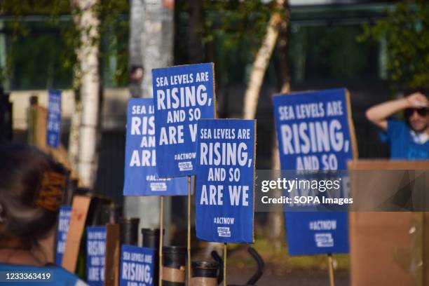Sea Levels Are Rising, And So Are We placards seen during the G7 protest. Extinction Rebellion activists gathered outside Tate Modern as part of the...