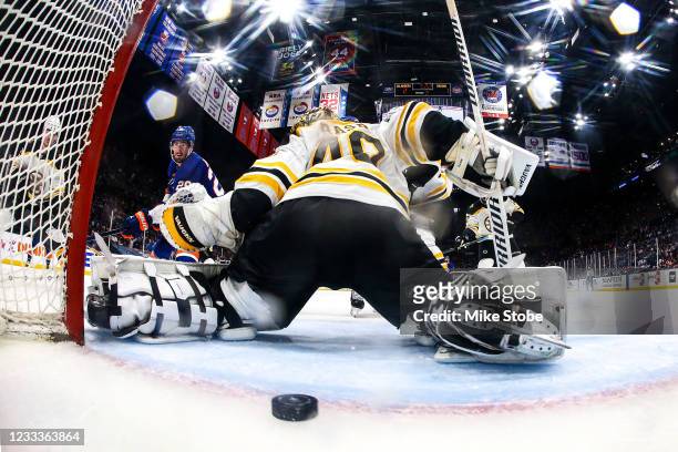 Brock Nelson of the New York Islanders scores a goal past Tuukka Rask of the Boston Bruins during the second period in Game Six of the Second Round...
