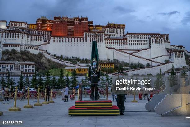 Chinese ceremonial military guard stand in front of the Potala Palace, a UNESCO heritage site, on June 1, 2021 in Lhasa, Tibet Autonomous Region,...