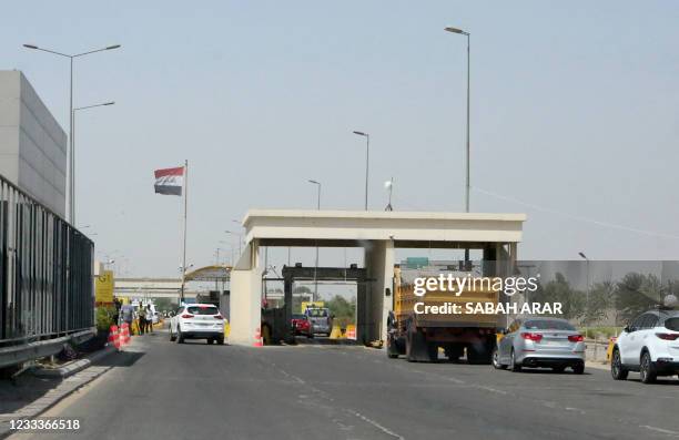 Photo taken on June 10, 2021 shows traffic at the entrance to Baghdad International Airport, one day after a booby-trapped drone struck the airport...