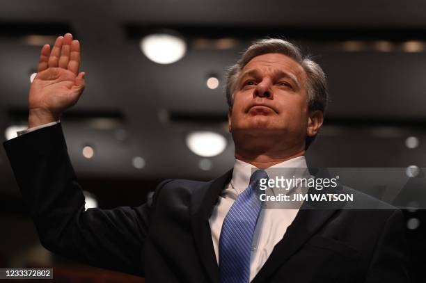 Director Christopher Wray is sworn in before a House Judiciary Committee hearing on "Oversight of the Federal Bureau of Investigation," on Capitol...