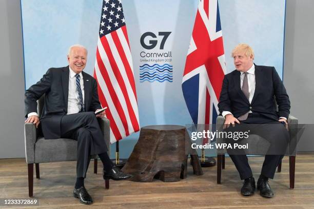 Britain's Prime Minister Boris Johnson speaks with U.S. President Joe Biden during their meeting, ahead of the G7 summit, at Carbis Bay Hotel, on...