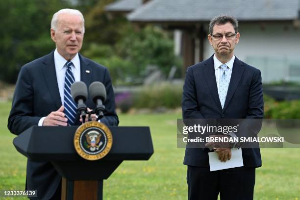 President Joe Biden delivers a speech on the COVID-19 pandemic, as Pfizer CEO Albert Bourla stands alongside him, in St Ives, Cornwall on June 10...