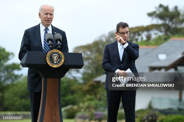 President Joe Biden delivers a speech on the COVID-19 pandemic, as Pfizer CEO Albert Bourla stands alongside him, in St Ives, Cornwall on June 10...
