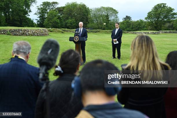 President Joe Biden delivers a speech on the COVID-19 pandemic, as Pfizer CEO Albert Bourla stands alongside him, in St Ives, Cornwall on June 10...