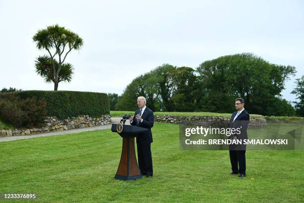 President Joe Biden delivers a speech on the COVID-19 pandemic, as Pfizer CEO Albert Bourla stands alongside him, in St Ives, Cornwall on June 10...