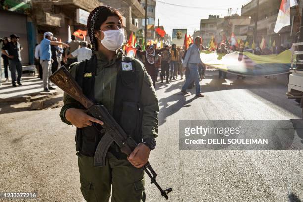 Syrian Kurds demonstrate on June 10 in the northeastern Syrian city of Qamishli against the Turkish offensive on Kurdistan Workers' Party areas in...