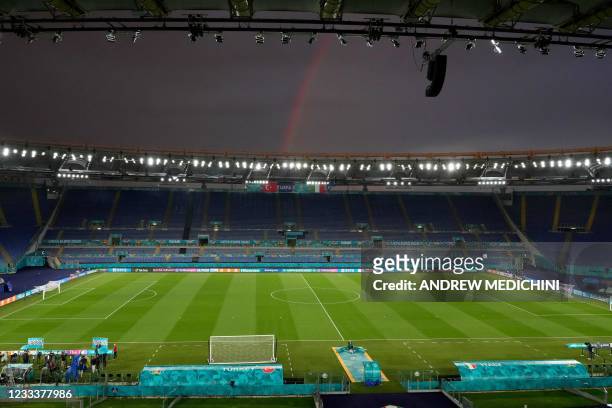 Rainbow is seen above the Olympic Stadium in Rome on June 10 during a training session for the Turkish national team on the eve of the UEFA EURO 2020...