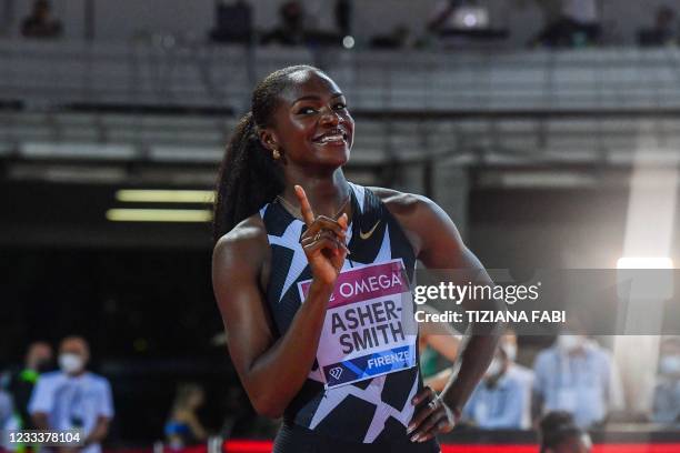 Britain's Dina Asher-Smith celebrates after winning the 200m Women during the Diamond League athletics meeting on June 10, 2021 at the Asics Firenze...