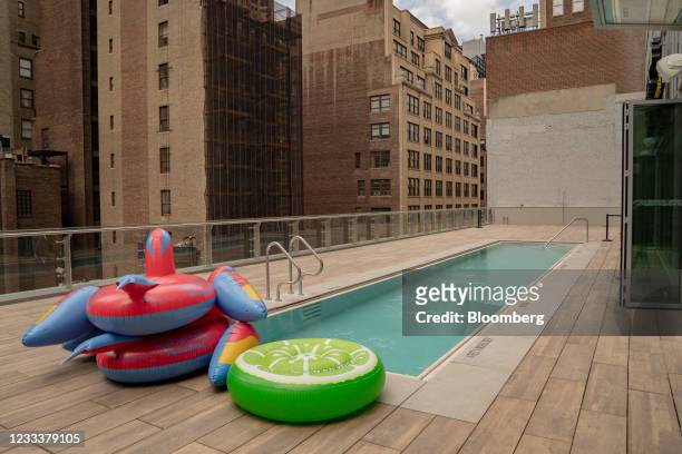 Inflatable floats on the rooftop pool at the Margaritaville Resort Times Square during the opening in New York, U.S., on Thursday, June 10, 2021. The...