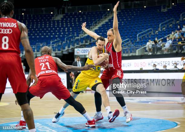 James Gist of FC Bayern Muenchen Basketball, Marcus Eriksson of Alba Berlin and Robin Amaize of FC Bayern Muenchen Basketball during the EASYCREDIT...