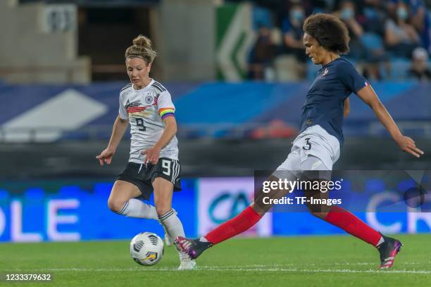 Svenja Huth of Germany and Wendie Renard of France battle for the ball during the international friendly match between France Women and Germany Women...