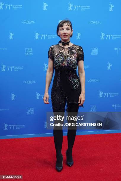 German actress Meret Becker poses on the red carpet ahead of the screening of the film "Fabian - Going to the Dog" as part of the 'Berlinale Summer...