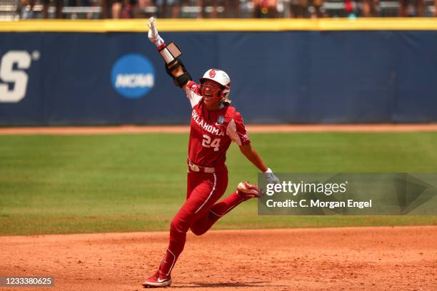 Jayda Coleman of the Oklahoma Sooners celebrates a home run against the Florida St. Seminoles during the Division I Womens Softball Championship held...