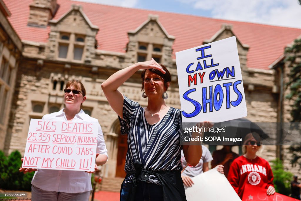 Protesters holding placards gather at Indiana University's...