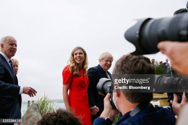 First Lady Jill Biden, second left, Carrie Johnson, wife of U.K. Prime minister Boris Johnson, second right, and Boris Johnson, U.K. Prime minster,...