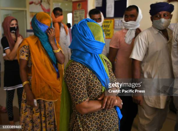 Rural people over 18 years of age wait in a queue to receive Covaxin at a vaccination centre in Liri village near Beawar. Rajasthan creates a big...