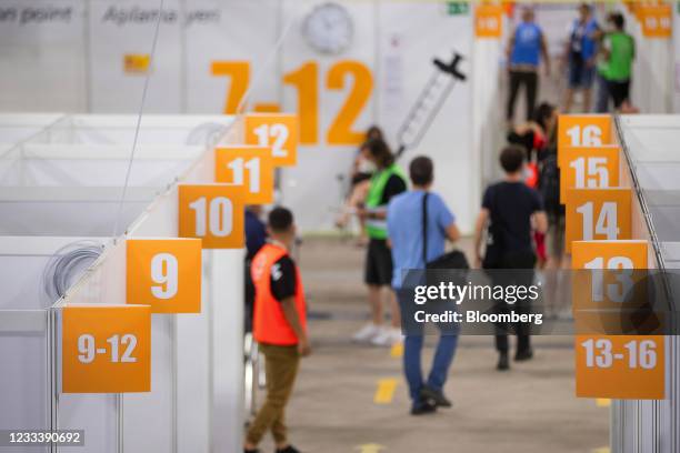 Numbered inoculation registration booths at a Covid-19 vaccination center in the Erika-Hess ice rink stadium in Berlin, Germany, on Friday, June 11,...