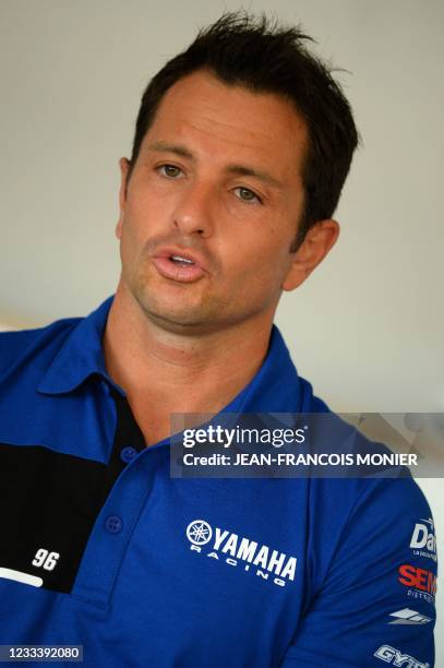 Yamaha YZF-R1 Formula EWC N°96 French rider Randy de Puniet answers a journalist's question after the qualifying practice session of the Le Mans...