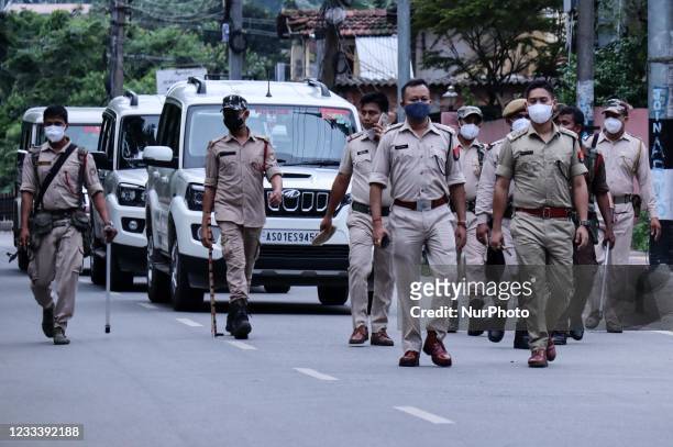 Assam police personnel patrol on road as they urges people to go home during COVID-19 lockdown, in Guwahati, India on Friday, 11 June 2021.