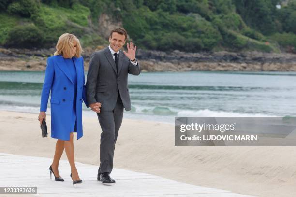 France's President Emmanuel Macron and France's First Lady Brigitte Macron arrive for the welcome prior to the start of the G7 summit in Carbis Bay,...