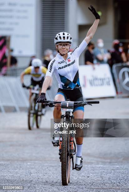 France's Loana Lecomte celebrates after winning the Women's Cross Country Short Track competition of the UCI Mountain Bike World Cup in Leogang,...