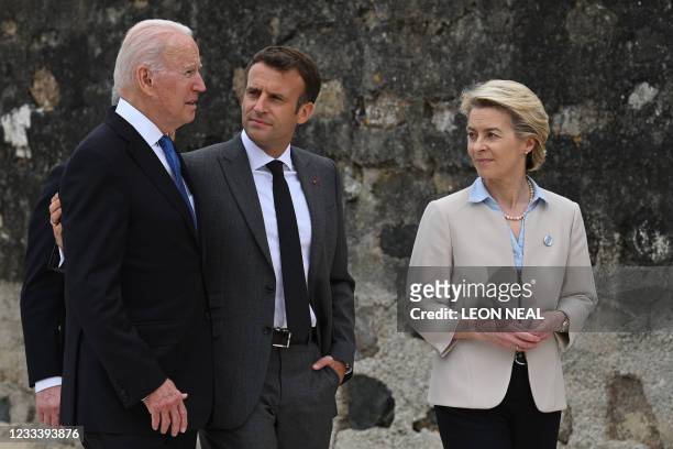 President Joe Biden and France's President Emmanuel Macron speak as President of the European Commission Ursula von der Leyen looks on after the...
