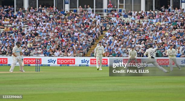 England's Ollie Pope fields the ball after a shot from New Zealand's Ross Taylor during the second day of the second Test match between England and...