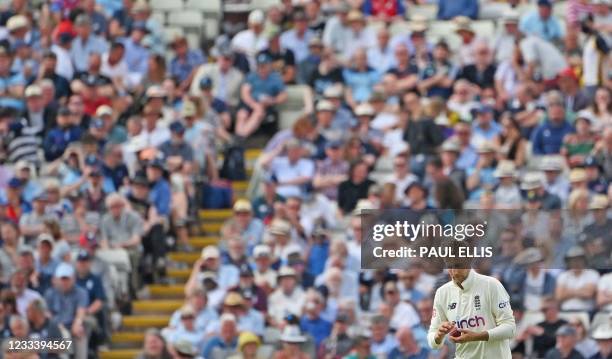 England's Joe Root prepares to bowl during the second day of the second Test match between England and New Zealand at Edgbaston Cricket Ground in...