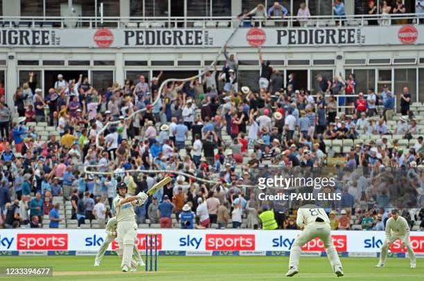 Beer snake' is passed through the crowd as New Zealand's Will Young bats during the second day of the second Test match between England and New...