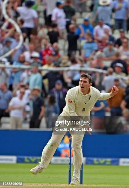 England's Dan Lawrence bowls during the second day of the second Test match between England and New Zealand at Edgbaston Cricket Ground in...